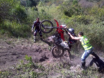 A marshal reaches forward to try and help